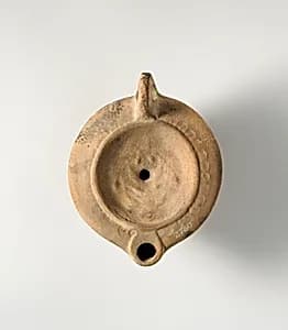 Terracotta oil lamp by Unknown Artist