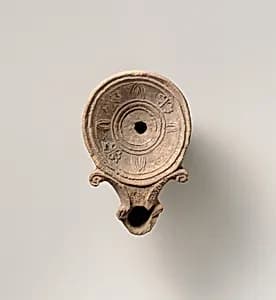 Terracotta oil lamp by Unknown Artist