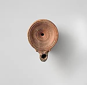 Terracotta oil lamp by Unknown Artist