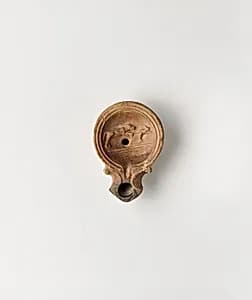 Terracotta oil lamp by Unknown Artist