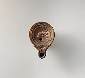 Terracotta oil lamp by Unknown Artist
