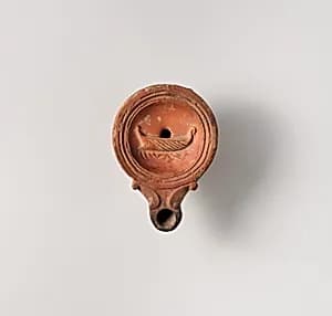 Terracotta oil lamp by Unknown Artist