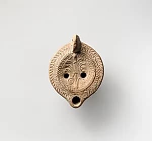 Terracotta oil lamp by Unknown Artist