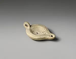 Terracotta oil lamp by Unknown Artist