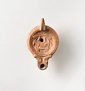 Terracotta oil lamp by Unknown Artist