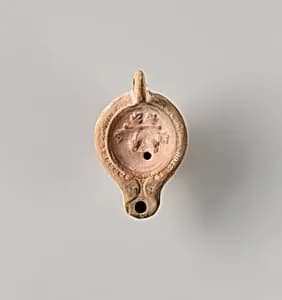 Terracotta oil lamp by Unknown Artist