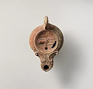 Terracotta oil lamp by Unknown Artist