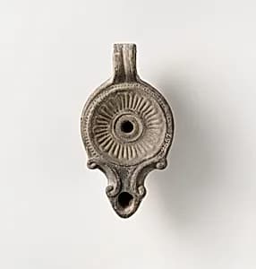Terracotta oil lamp by Unknown Artist