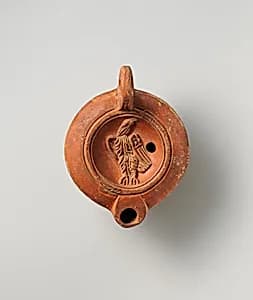 Terracotta oil lamp by Unknown Artist