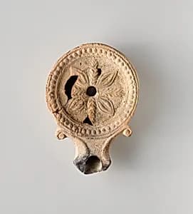Terracotta oil lamp by Unknown Artist