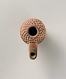 Terracotta oil lamp by Unknown Artist