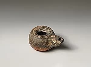 Terracotta oil lamp by Unknown Artist