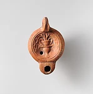 Terracotta oil lamp by Unknown Artist