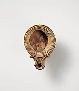 Terracotta oil lamp by Unknown Artist