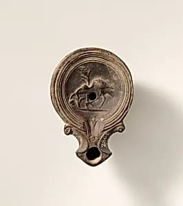 Terracotta oil lamp by Unknown Artist