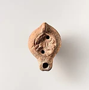 Terracotta oil lamp by Unknown Artist