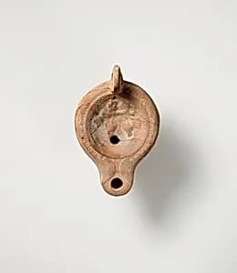 Terracotta oil lamp by Unknown Artist
