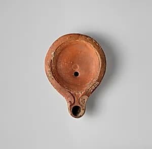 Terracotta oil lamp by Unknown Artist