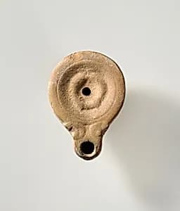 Terracotta oil lamp by Unknown Artist