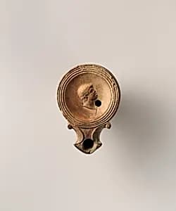 Terracotta oil lamp by Unknown Artist