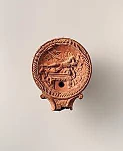 Terracotta oil lamp by Unknown Artist