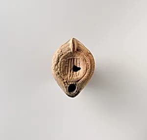 Terracotta oil lamp by Unknown Artist