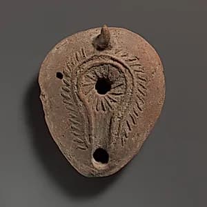 Terracotta oil lamp by Unknown Artist