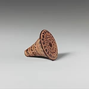 Terracotta spindle whorl by Unknown Artist
