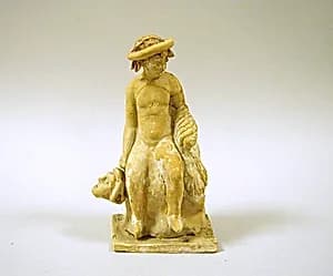 Terracotta statuette of a seated youth by Unknown Artist