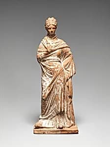 Terracotta statuette of a standing woman by Unknown Artist