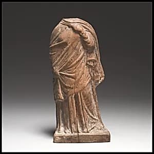 Terracotta statuette of a woman by Unknown Artist