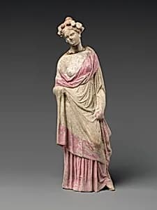 Terracotta statuette of a woman by Unknown Artist