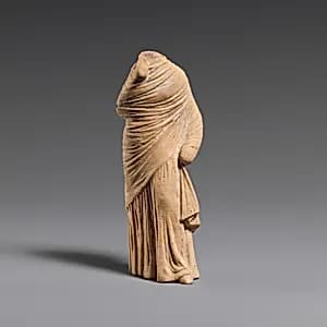 Terracotta statuette of a woman by Unknown Artist