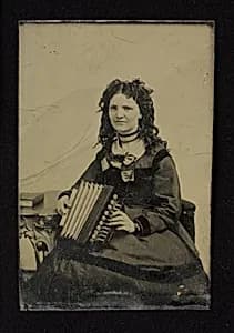 Woman Holding an Accordion tintype by Unknown Artist