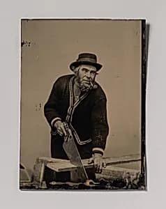 [Carpenter Sawing a Plank of Wood] by Unknown