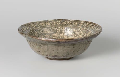 Bowl with a flower roundel and ornamental borders by anonymous; anonymous