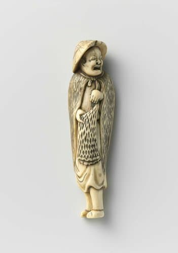 Netsuke in the form of a fisherman in rain wear by anonymous