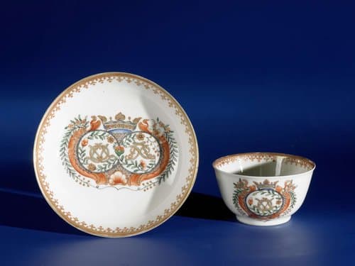 Bell-shaped cup and saucer with a crowned double monogram by anonymous