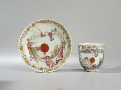 Bell-shaped cup and saucer with an erotic scene by anonymous