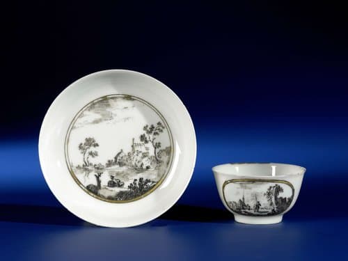 Bell-shaped cup and saucer with Dutch landschapes in medallions by anonymous