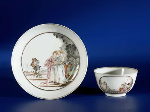 Bell-shaped cup and saucer with European figures in a landscape by anonymous