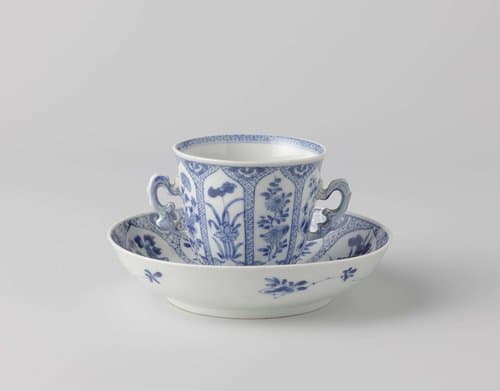 Cup and saucer with flower sprays in a panel decoration by anonymous