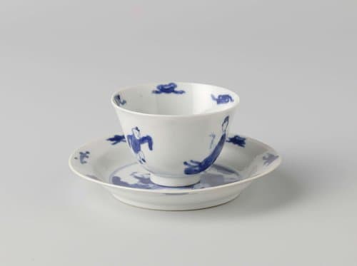 Cup and saucer with a woman and boy by anonymous