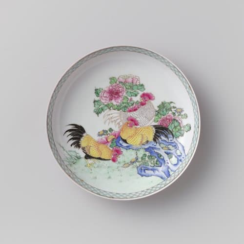 Saucer-dish with three cocks on a rock near flowering plants by anonymous