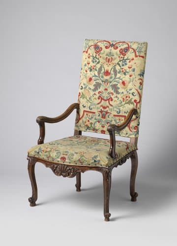 Armstoel van notenhout met petit-point bekleding by anonymous