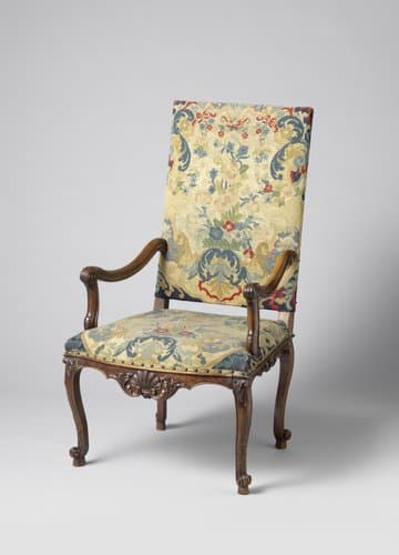 Armstoel van notenhout met petit-point bekleding by anonymous