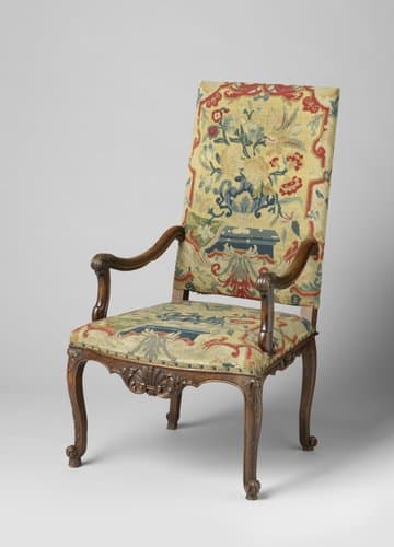 Armstoel van notenhout met petit-point bekleding by anonymous
