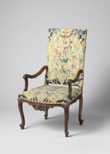 Armstoel van notenhout met petit-point bekleding by anonymous