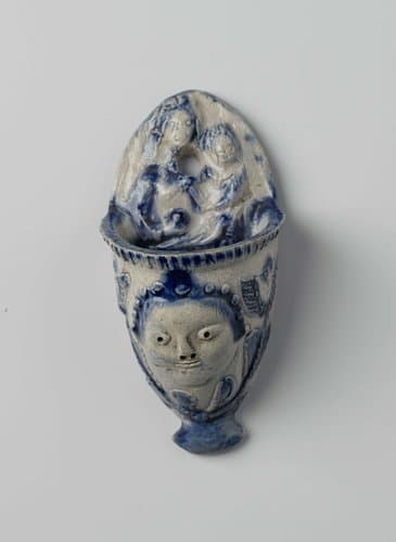 Wijwaterbak met een engelenkop en Maria met Kind by anonymous