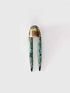 Topknot pin by Unknown